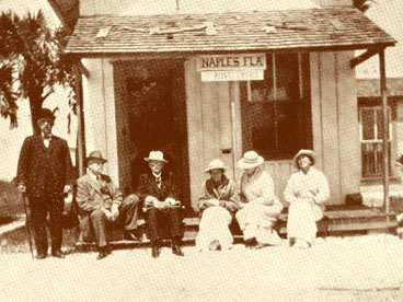 Three unidentified men and three unidentified women seated on steps of Naples firt post office Circa 1900.