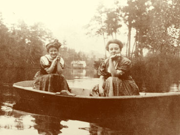 Two unidentified ladies in row boat in lake.  Dated March 1909. (John Hachmeister Collection)