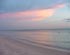 Sunset at the beach by the Historic Naples Pier.